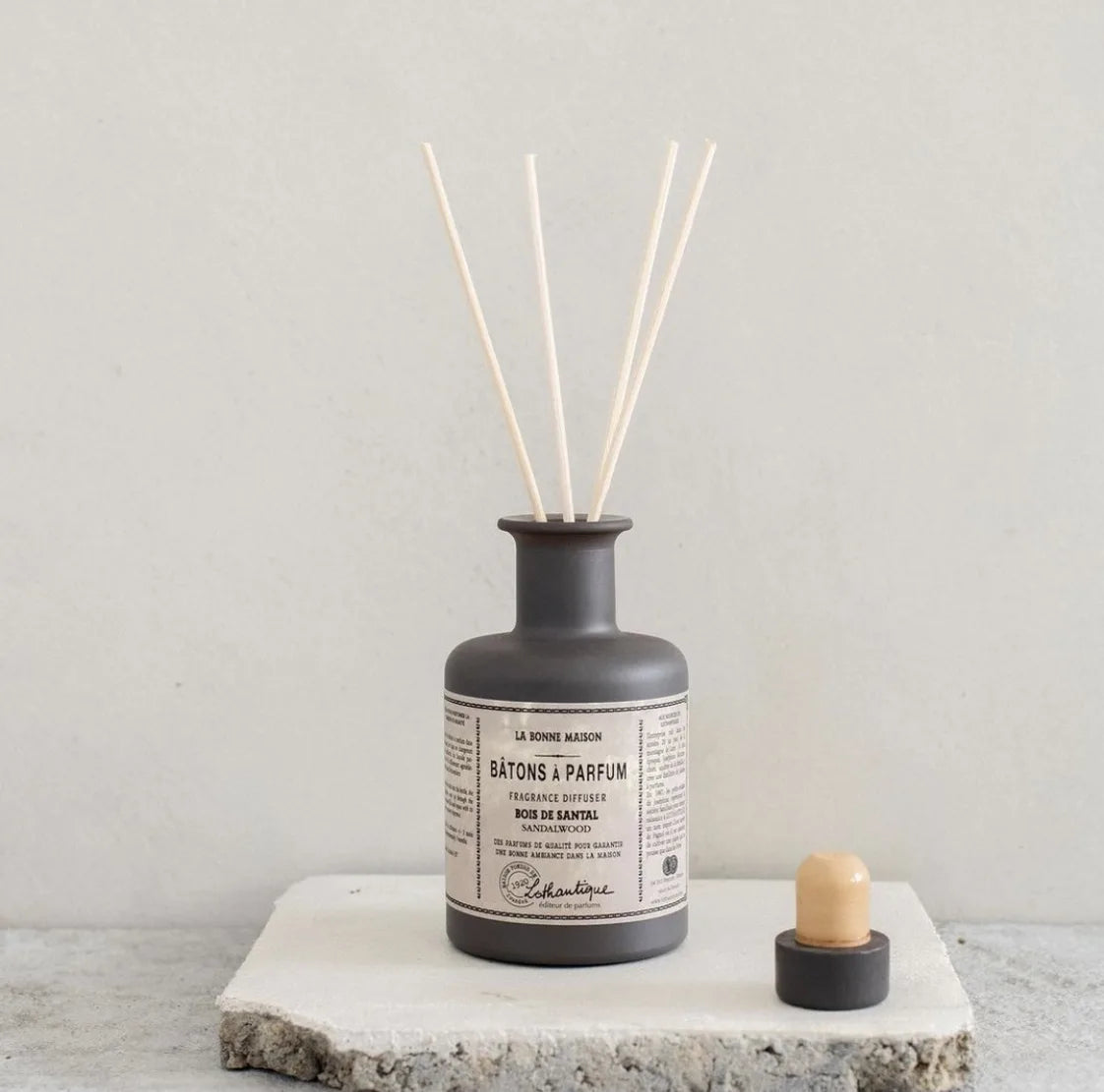 Lothantique La Bonne Maison Sandalwood diffuser on a stone slab